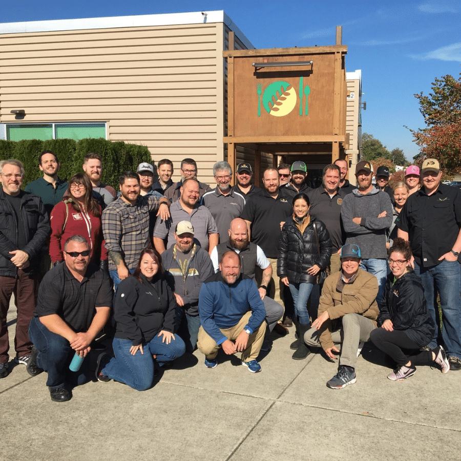 GWM and CMG team volunteering at Oregon Food Bank. Group shot posed.